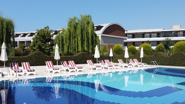 Indoor pool, seasonal outdoor pool, pool umbrellas, pool loungers