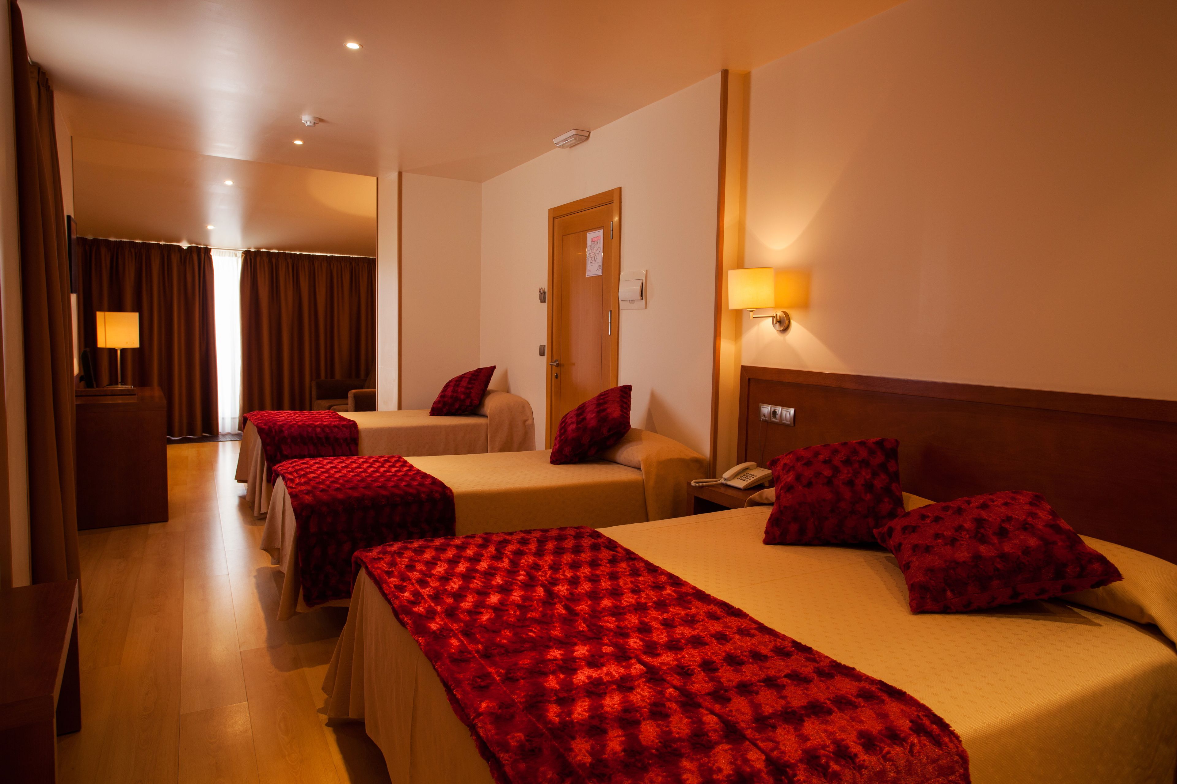 family room | minibar, in-room safe, desk, blackout curtains