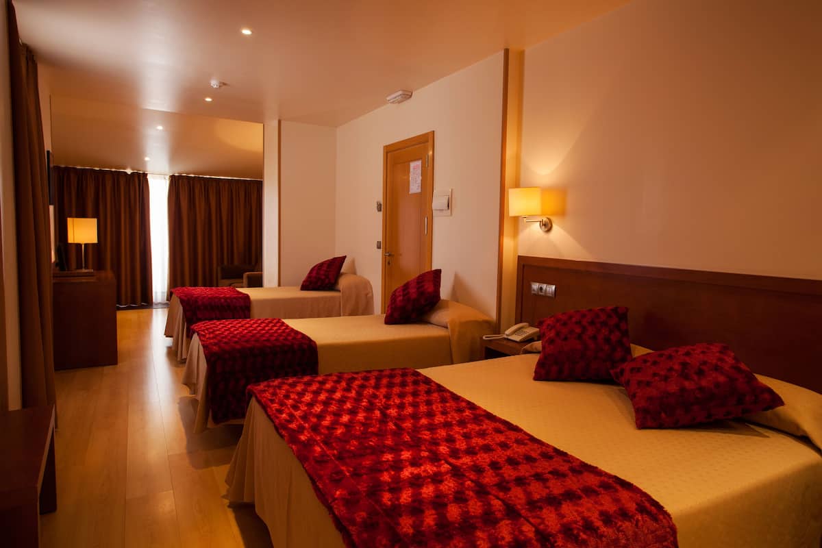 family room | minibar, in-room safe, desk, blackout curtains