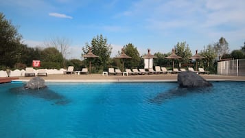 Seasonal outdoor pool, pool loungers