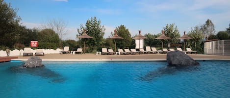 Seasonal outdoor pool, pool loungers