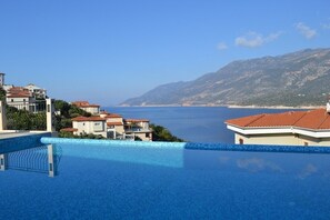Outdoor pool, pool umbrellas, pool loungers