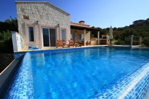 Outdoor pool, pool umbrellas, pool loungers