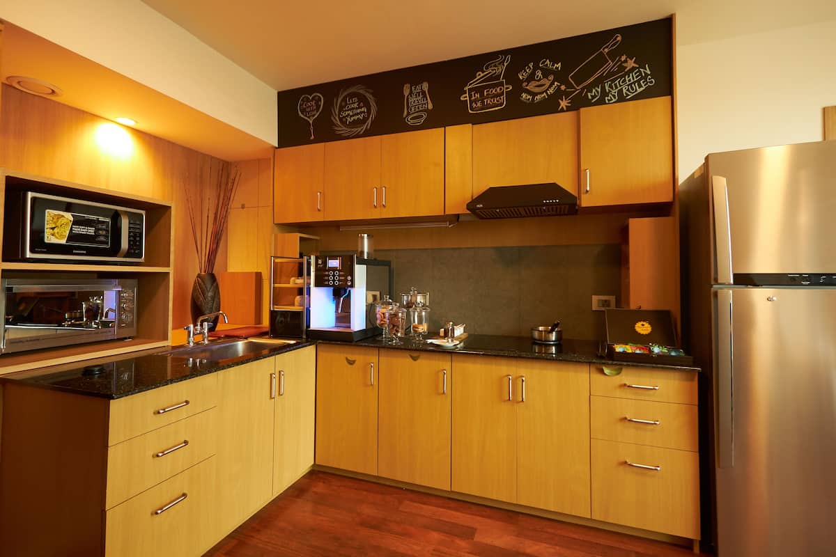 executive room king bed with additional privileges | shared kitchen facilities | coffee/tea maker, electric kettle, eco-friendly cleaning products