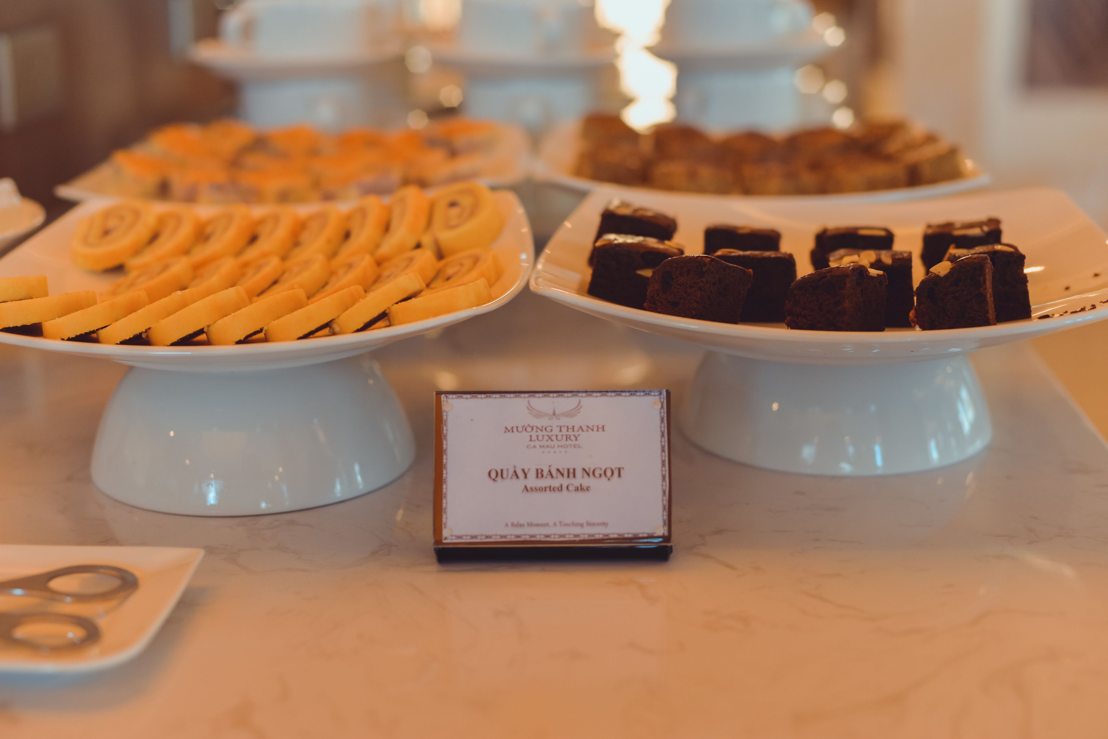 A dessert display with assorted cakes and pastries.