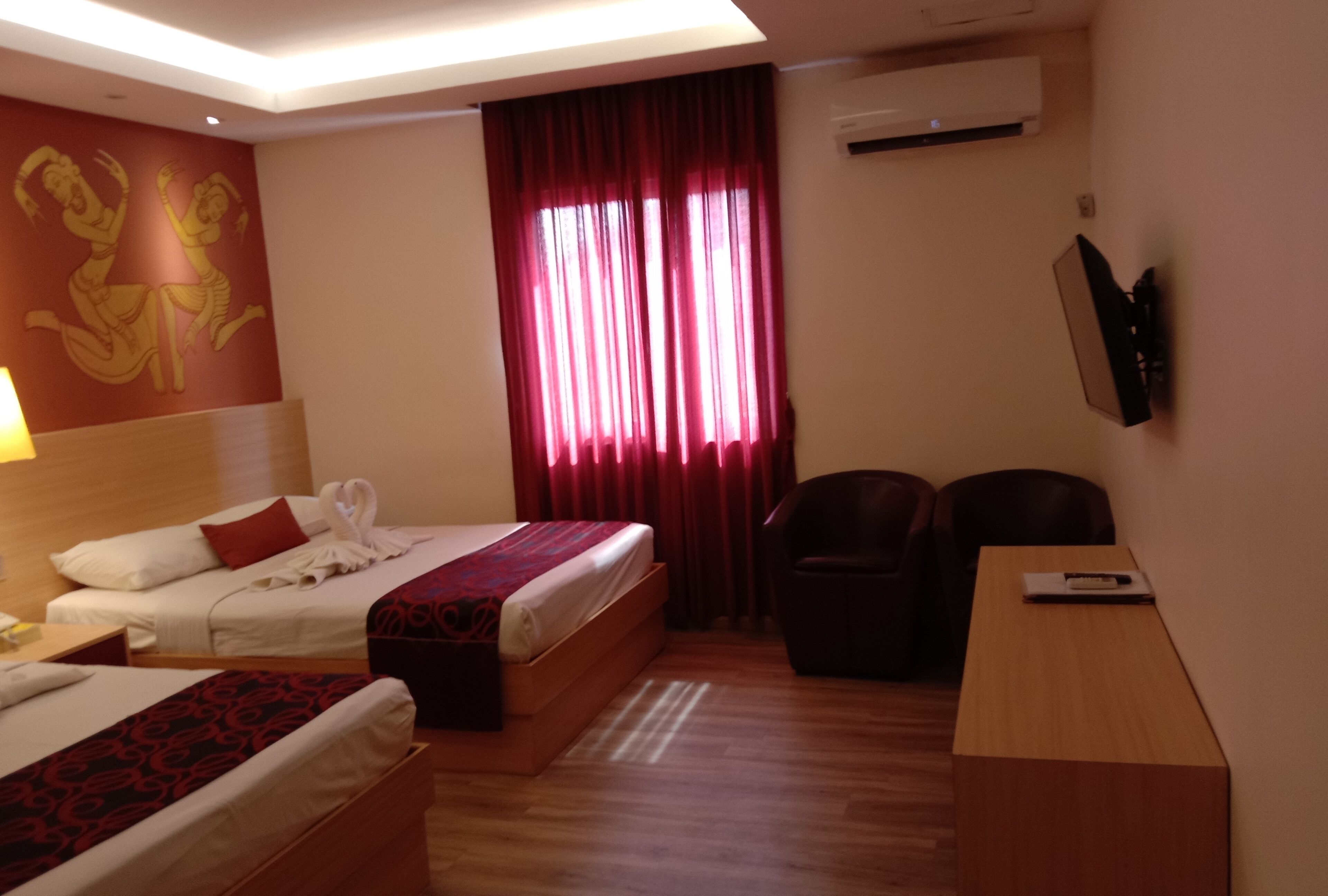 family room | minibar, in-room safe, desk, blackout curtains