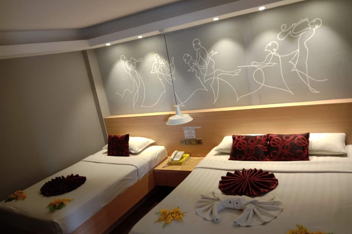 family room | minibar, in-room safe, desk, blackout curtains