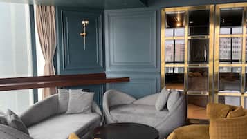 Presidential Suite | Living area | 40-inch flat-screen TV with cable channels, TV