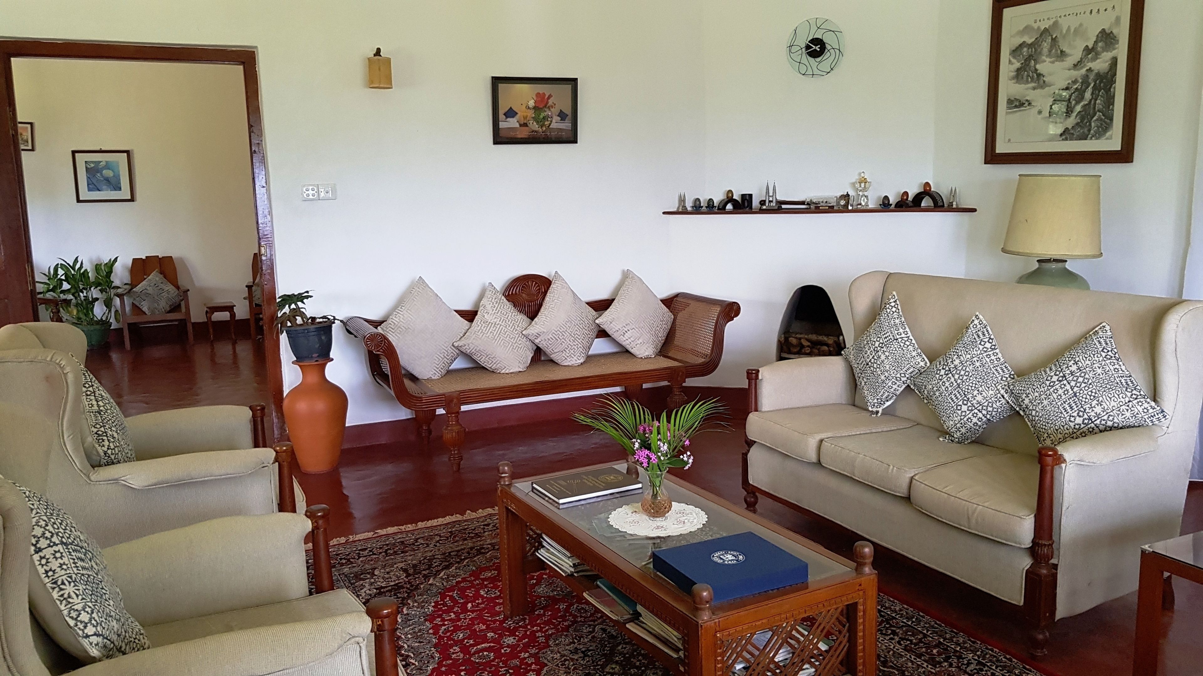 A living room with two sofas, a coffee table, and a bookshelf.
