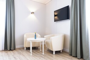 32-inch flat-screen TV with cable channels, TV