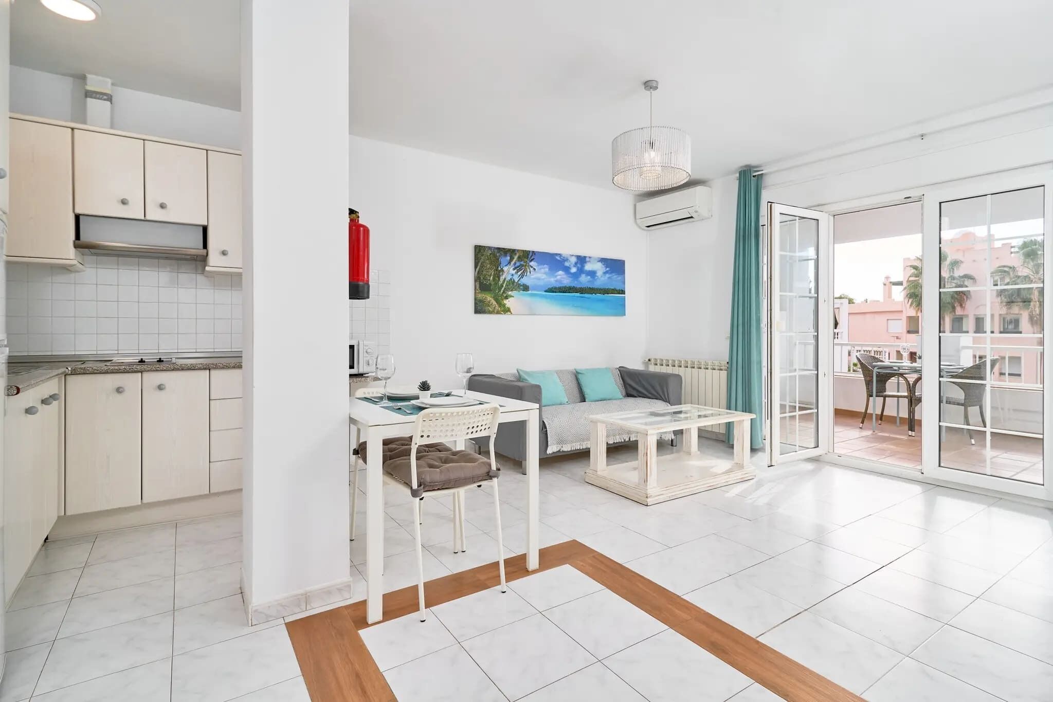 A modern apartment with a kitchen, dining area, and living room.