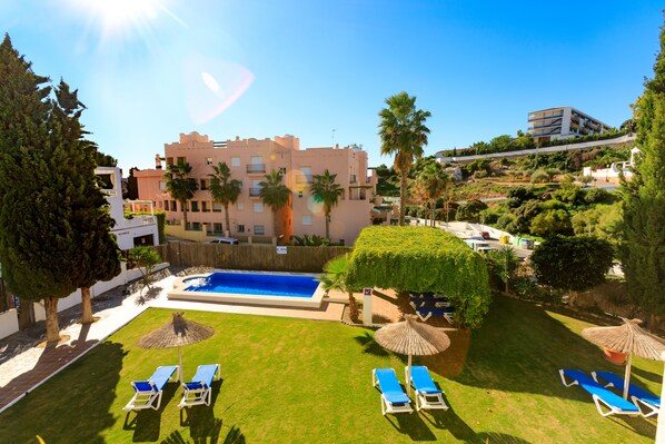 Outdoor pool, open 10:00 AM to 8:00 PM, pool loungers