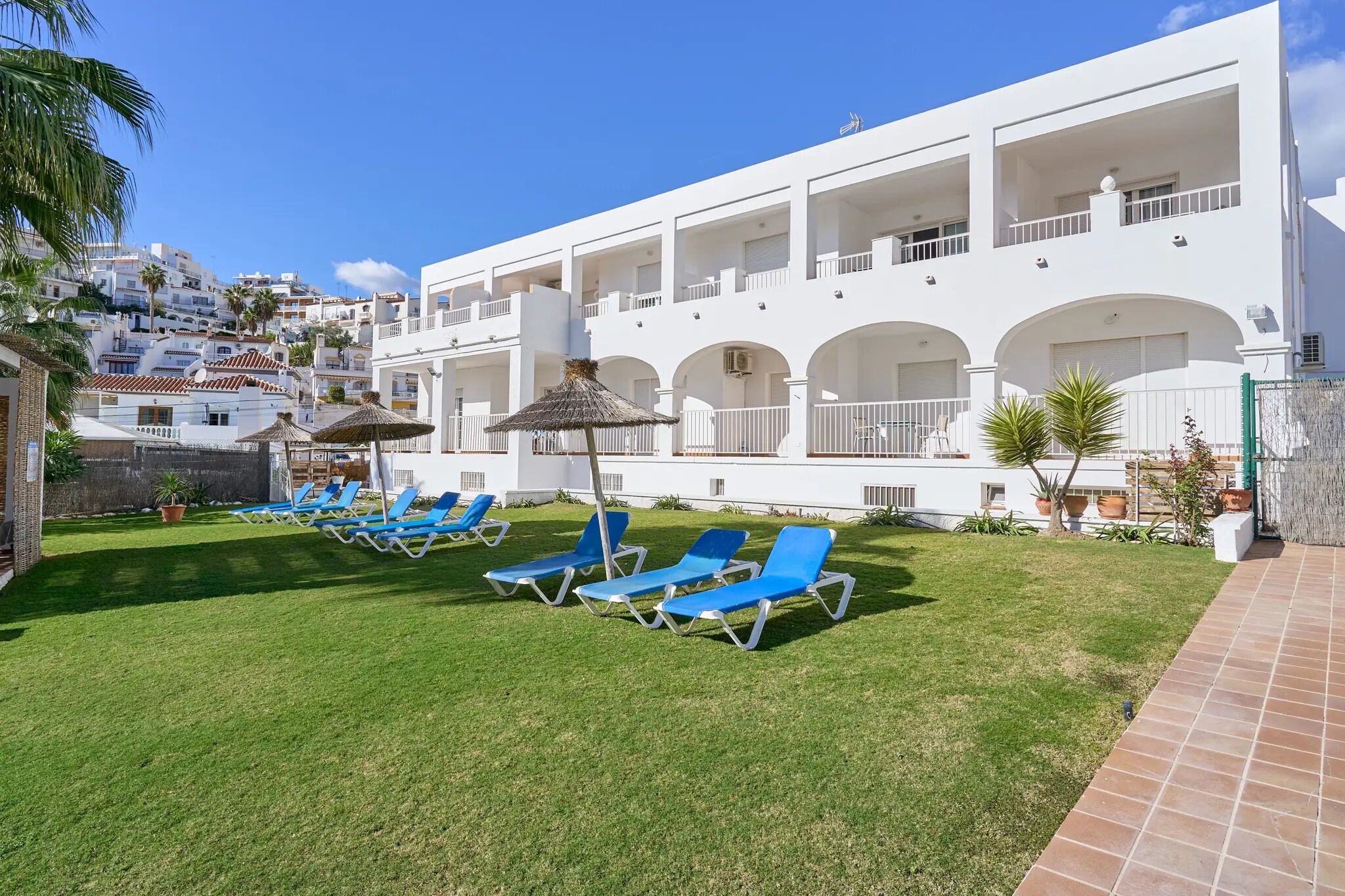 Outdoor pool, open 10:00 AM to 8:00 PM, pool loungers