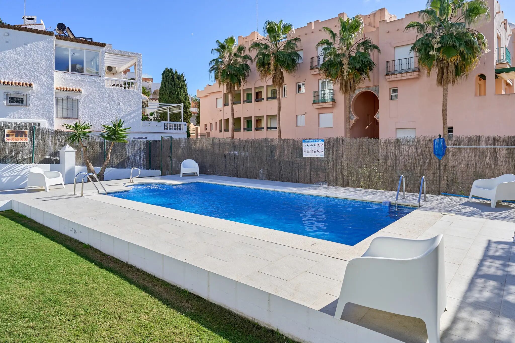 Outdoor pool, open 10:00 AM to 8:00 PM, pool loungers