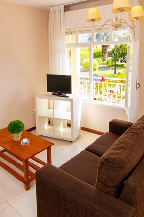 24-inch flat-screen TV with digital channels, TV