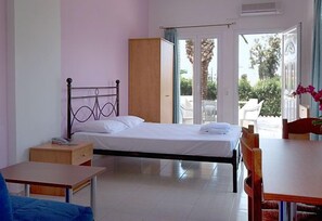 Triple Room | Living area | Flat-screen TV