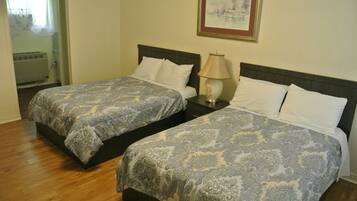 Standard Quadruple Room, 2 Double Beds | Free WiFi, bed sheets