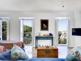 Premium Apartment, 1 Bedroom | Living area | 28-inch flat-screen TV with satellite channels, TV, toys