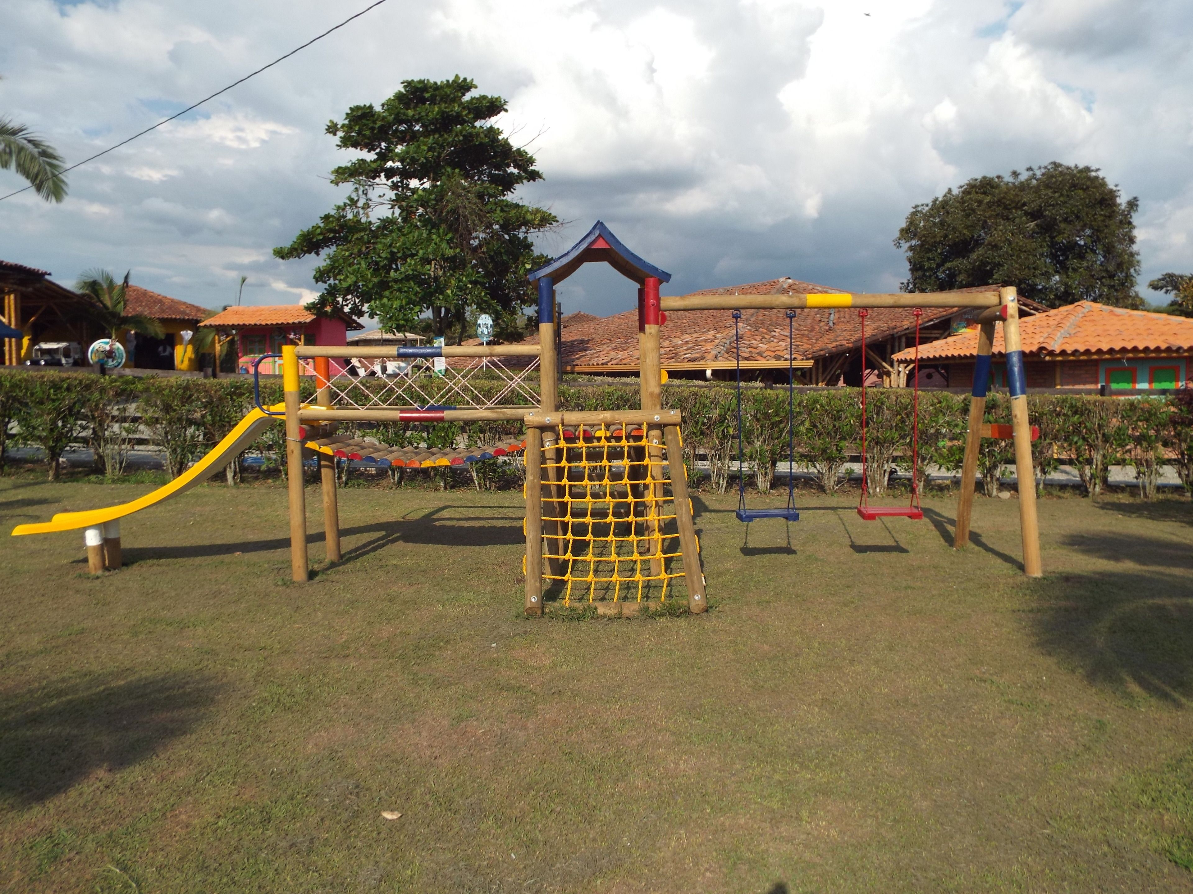 A playground with a slide, swings, and a climbing structure.