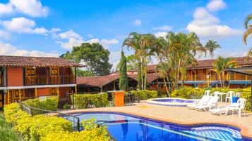 Outdoor pool, open 9:00 AM to 10:00 PM, sun loungers