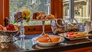 A breakfast buffet with various food items and condiments. - The Wild Iris Inn (La Conner)