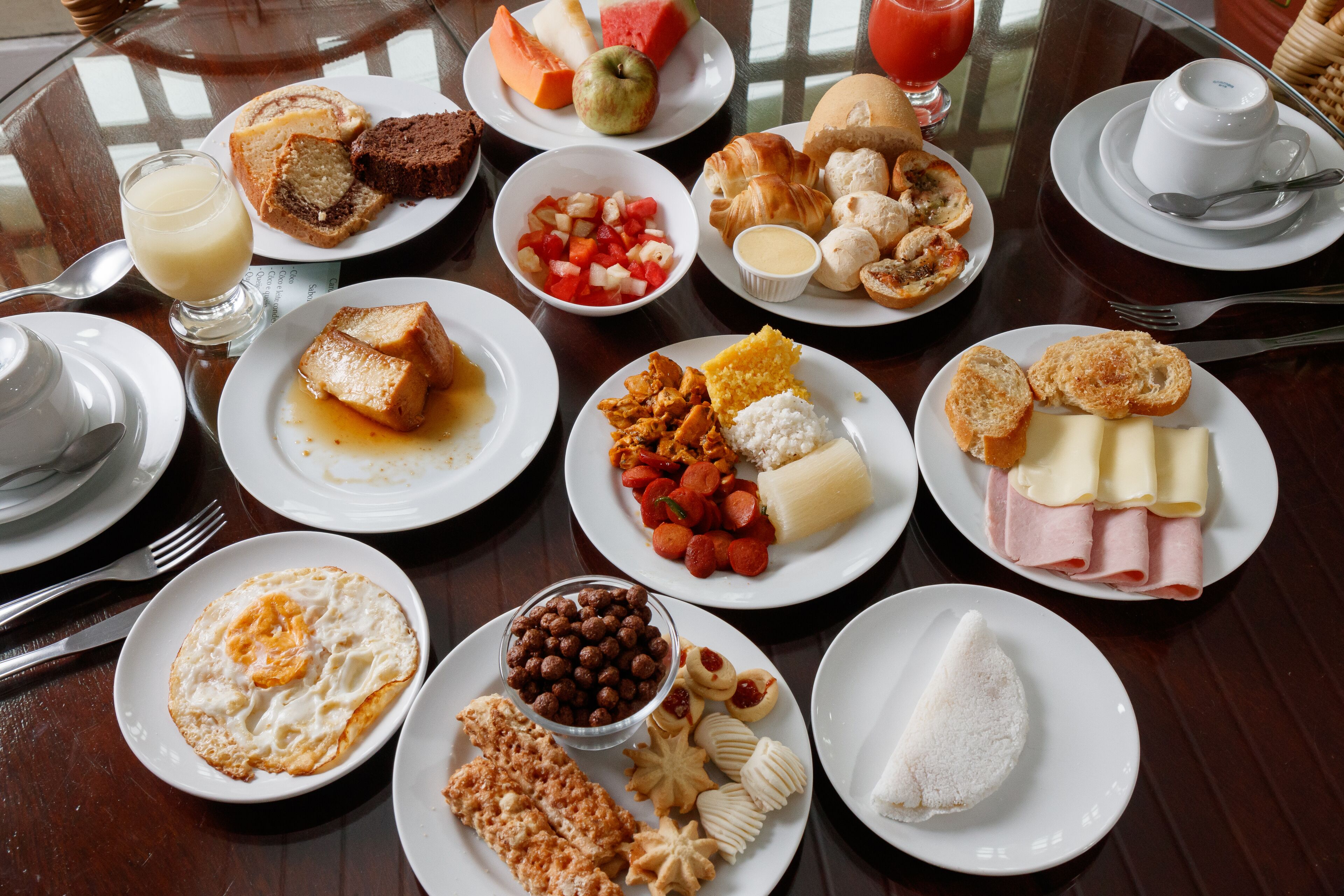 A breakfast buffet with various food items and beverages.