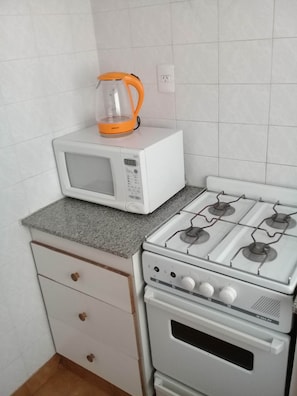 Mini-fridge, microwave, oven, stovetop