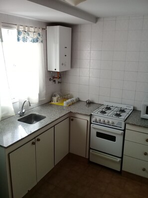 Mini-fridge, microwave, oven, stovetop