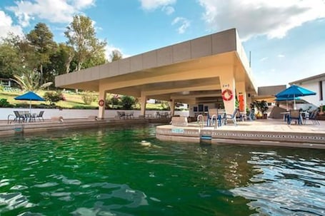 Indoor pool, open 7:00 AM to 10:00 PM, pool umbrellas, sun loungers