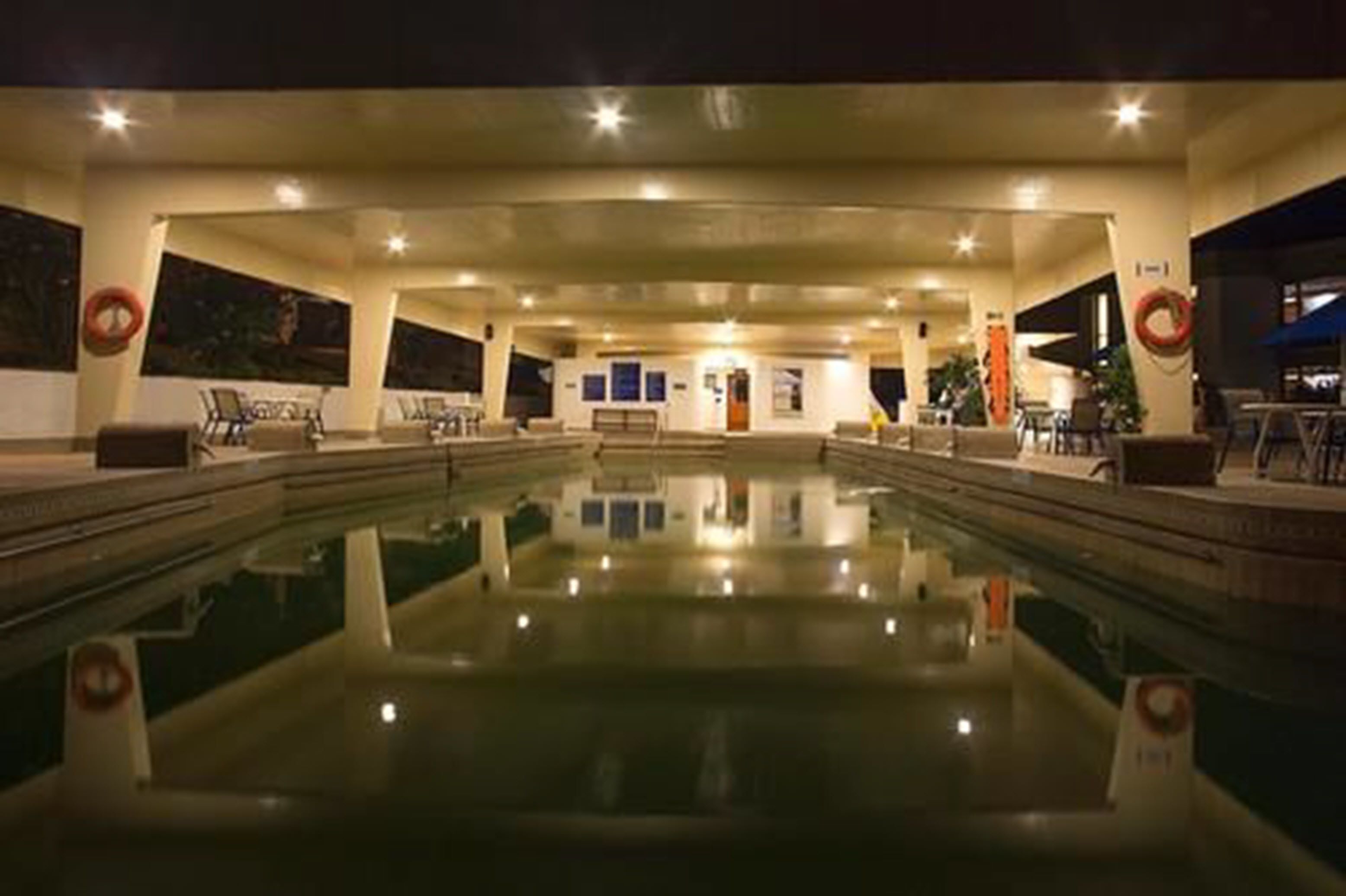 indoor pool, open 7:00 am to 10:00 pm, pool umbrellas, pool loungers