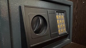 A keypad lock on a door, likely for a secure room or storage area.