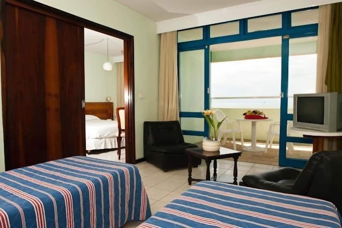 Superior Quadruple Room, Pool View | 1 bedroom, minibar, desk, blackout curtains