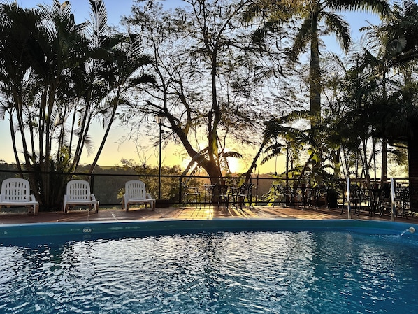 Outdoor pool, open 9:00 AM to 8:00 PM, pool loungers