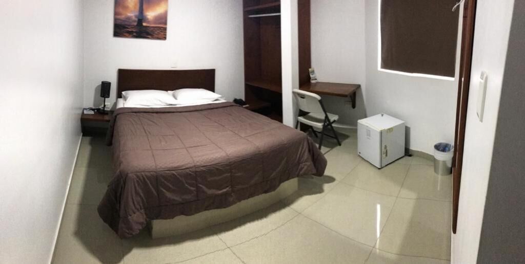 desk, laptop workspace, blackout curtains, iron/ironing board