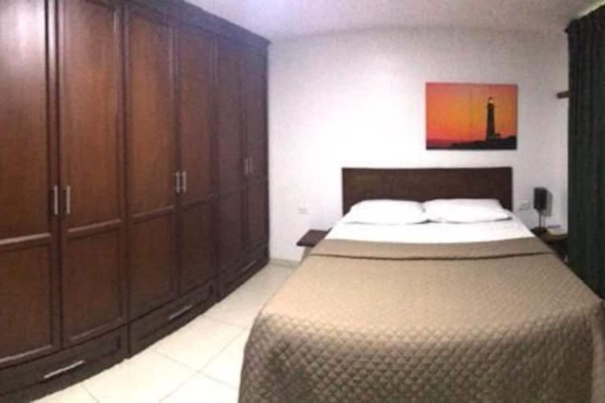 desk, laptop workspace, blackout curtains, iron/ironing board