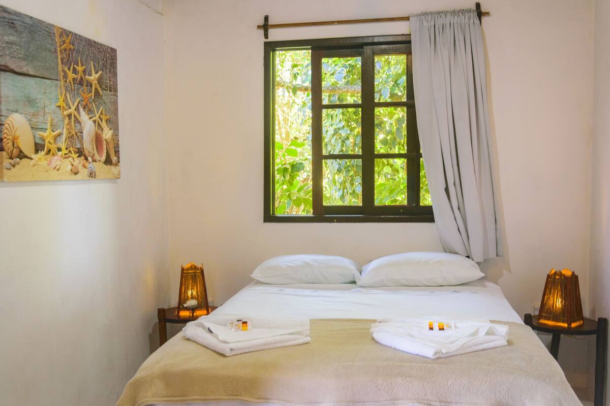 Economy Triple Room, Sea View | Minibar, WiFi (free), bed sheets