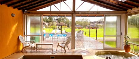 Indoor pool, seasonal outdoor pool, pool umbrellas, pool loungers