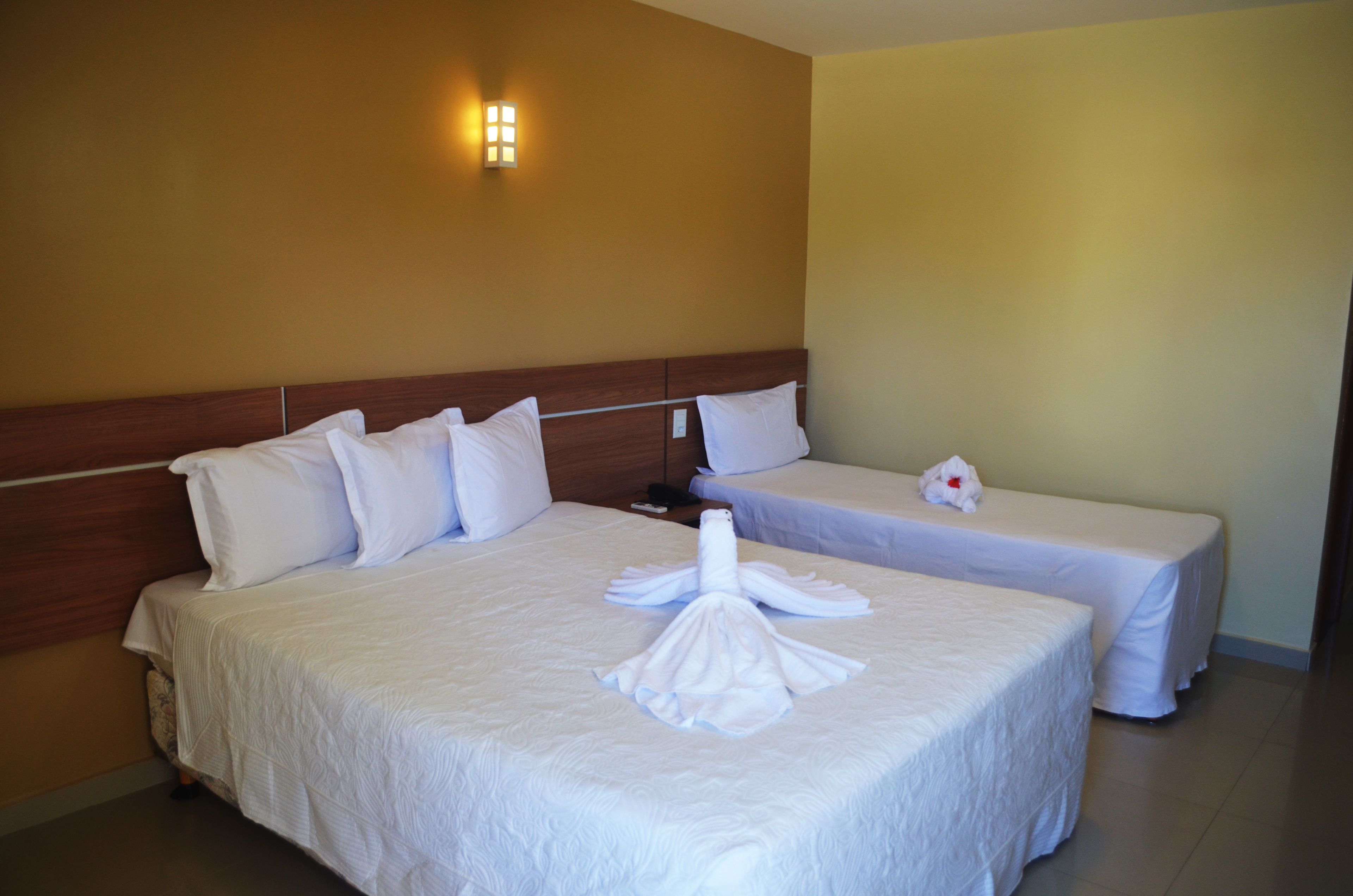 Triple Room | Minibar, in-room safe, blackout curtains, free cots/infant beds