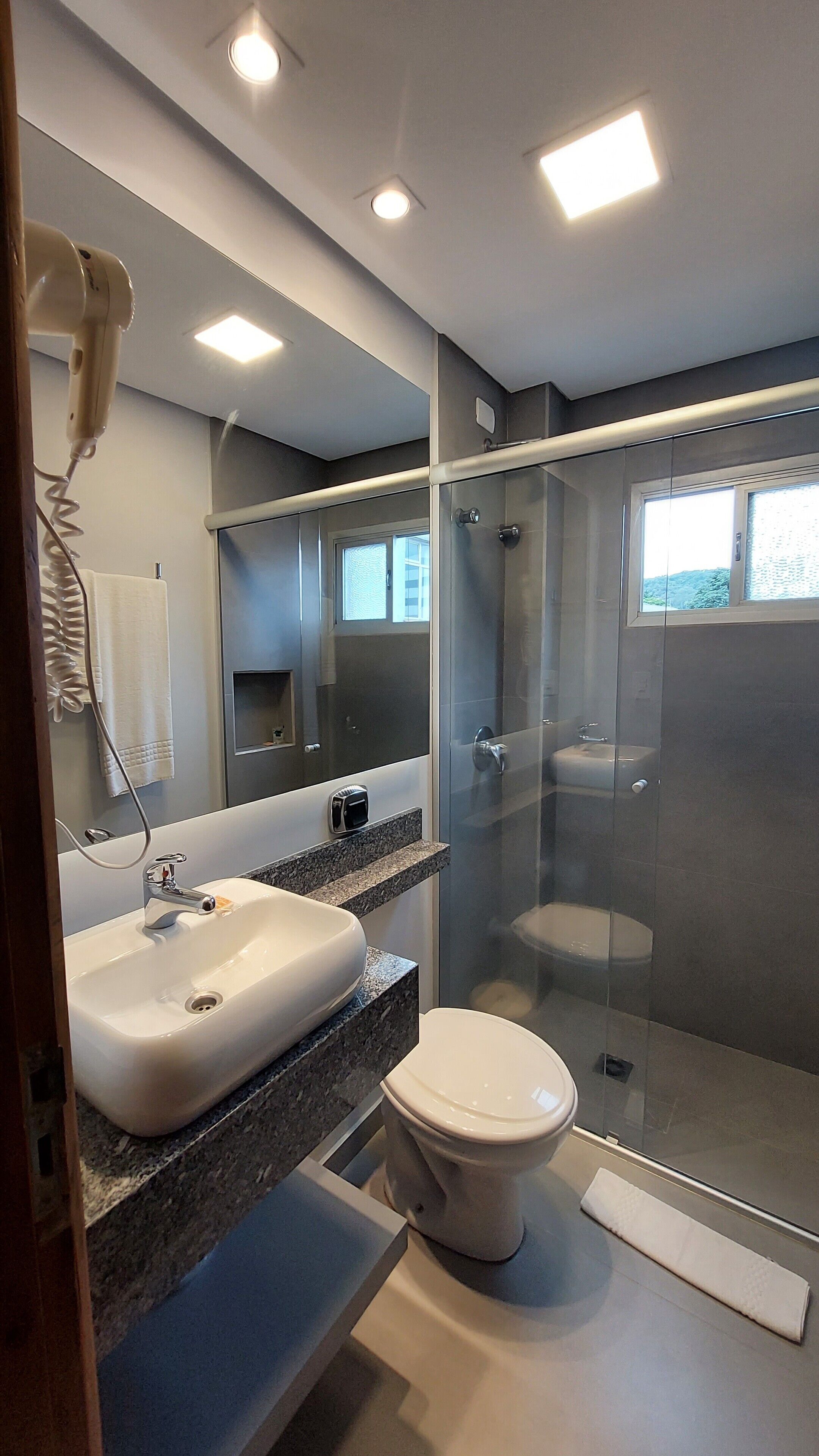 comfort loft | bathroom | hair dryer, towels, soap, shampoo