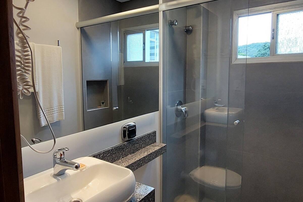 comfort loft | bathroom | hair dryer, towels, soap, shampoo