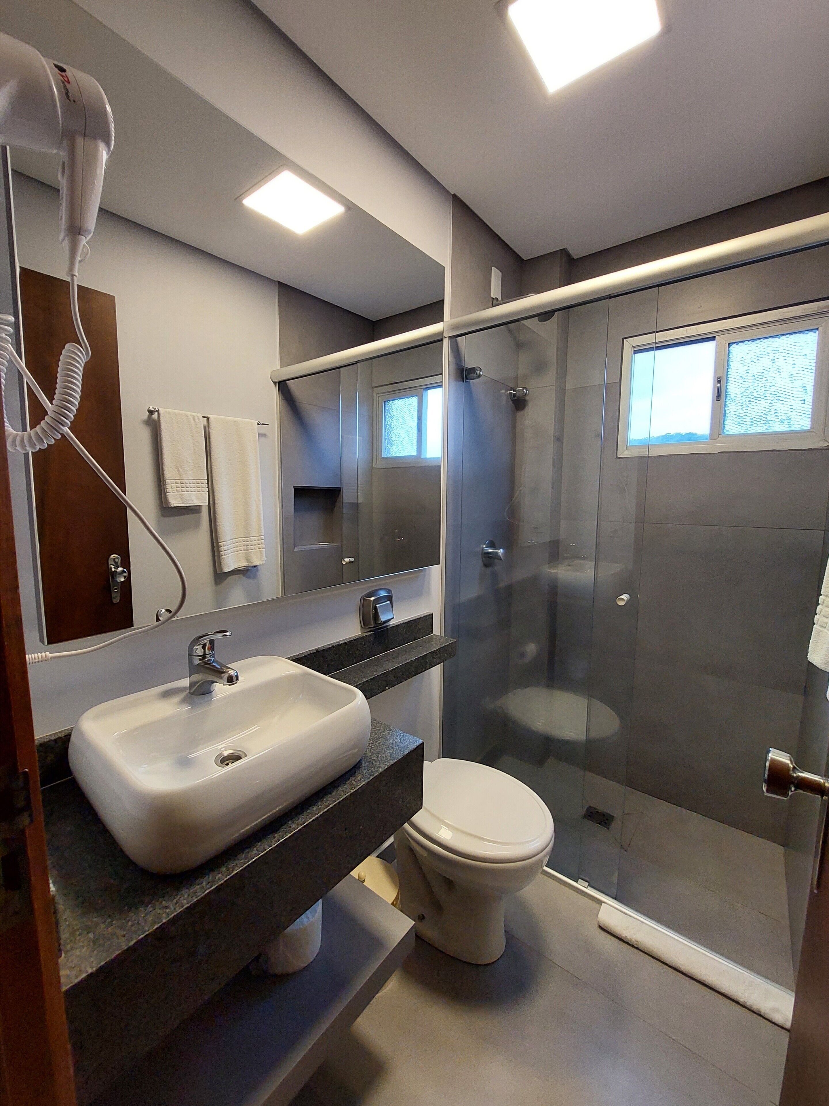 superior double room | bathroom | hair dryer, towels, soap, shampoo