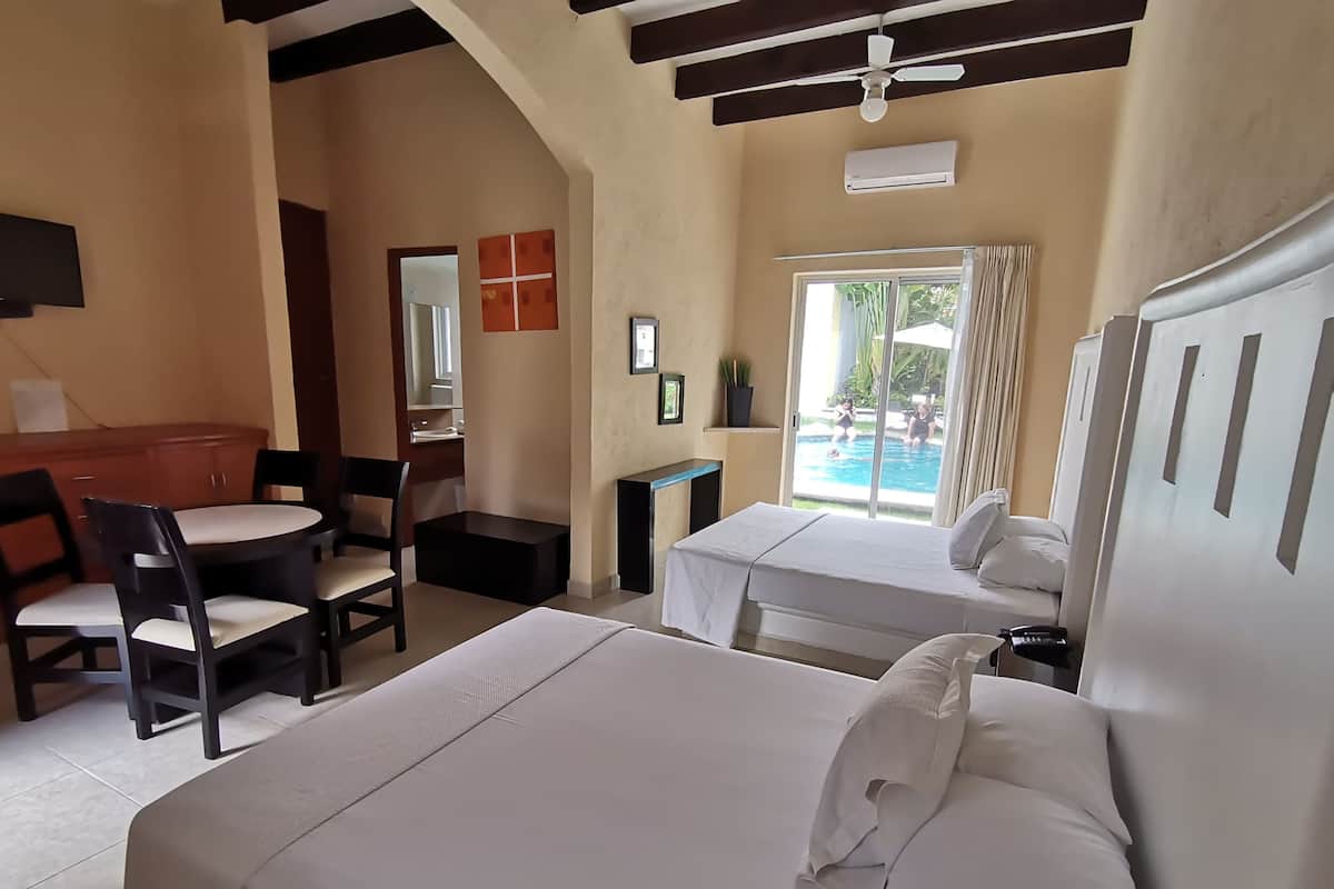 Master Suite Deluxe, Pool view | Premium bedding, pillowtop beds, desk, laptop workspace