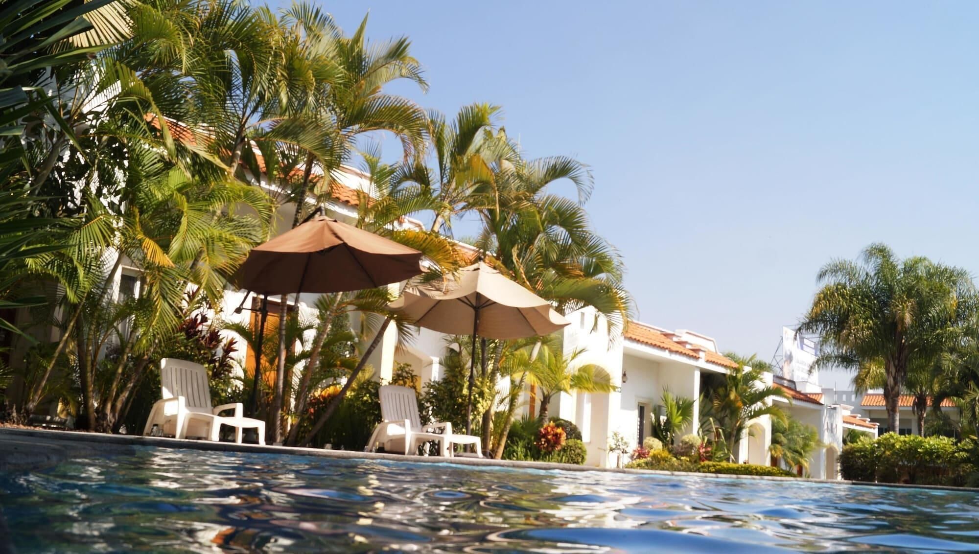 2 outdoor pools, open 9:00 AM to 9:00 PM, pool umbrellas, pool loungers