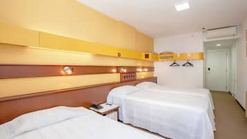 Deluxe Triple Room | Minibar, in-room safe, desk, blackout curtains