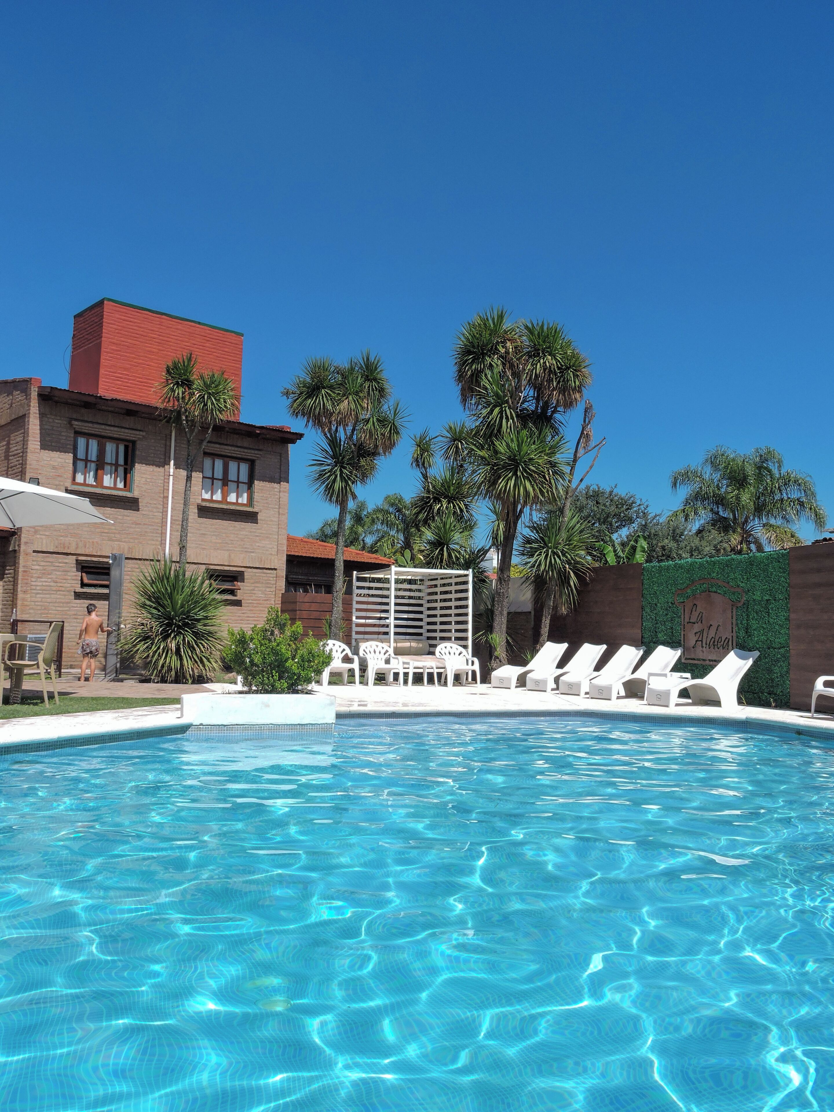 Outdoor pool, pool umbrellas, sun loungers