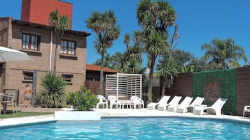 Outdoor pool, pool umbrellas, sun loungers