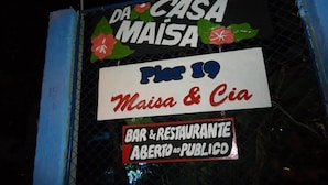 A sign for 'Da Casa Maisa' with a date 'April 19' and mentions 'Maisa & Cia' as a bar and restaurant open to the public. - Casa da Maisa (Porto Seguro)