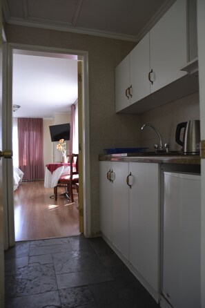 Standard Triple Room, 2 Bedrooms | Private kitchenette | Fridge, microwave, coffee/tea maker