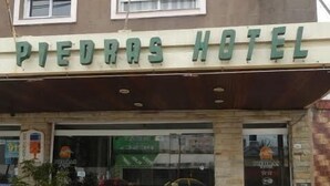 The exterior of the Piedra Hotel with a signboard above the entrance. - Hotel Piedras (San Clemente)