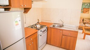 Family Cabin, 3 Bedrooms, 2 Bathrooms | Private kitchen | Fridge, microwave, stovetop, cookware/dishes/utensils - Cabañas Las Añañucas IV (La Serena)